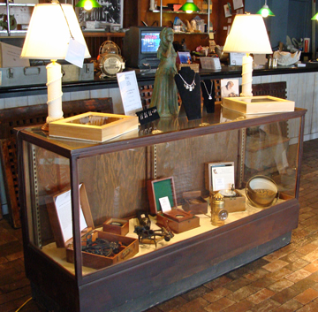Showcase housing sextants, chronometers, and boxed compasses.